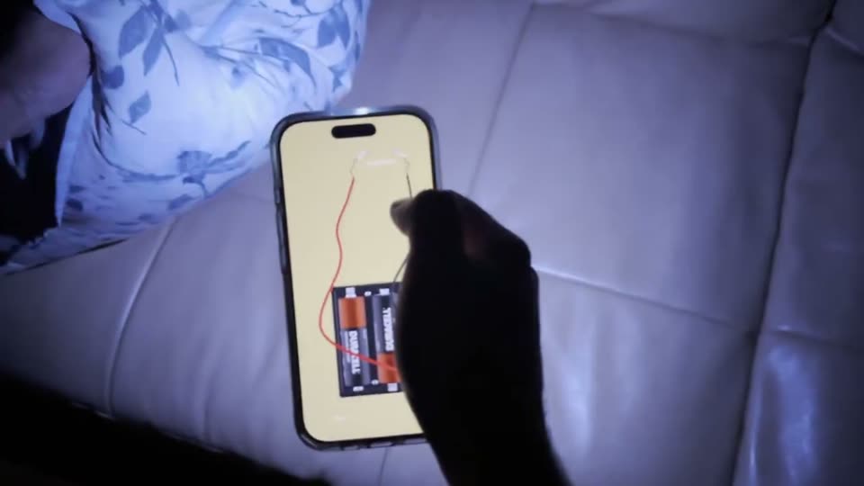 Circuit — Original in-context recording: virtual wire contact changes the phone’s physical flashlight.